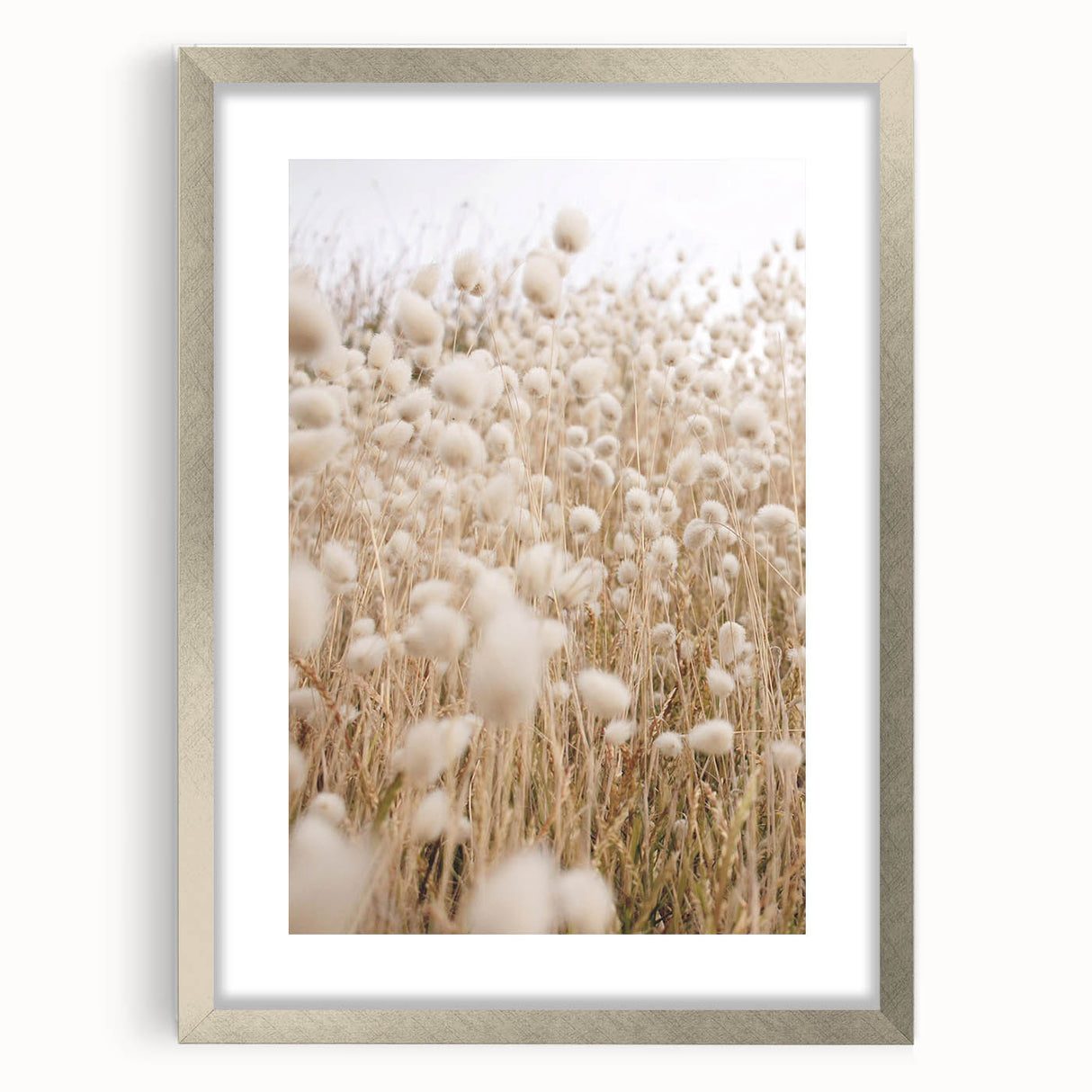 Textured art depicting abstract summer-themed imagery in vibrant orange and yellow hues on a silver-framed canvas.