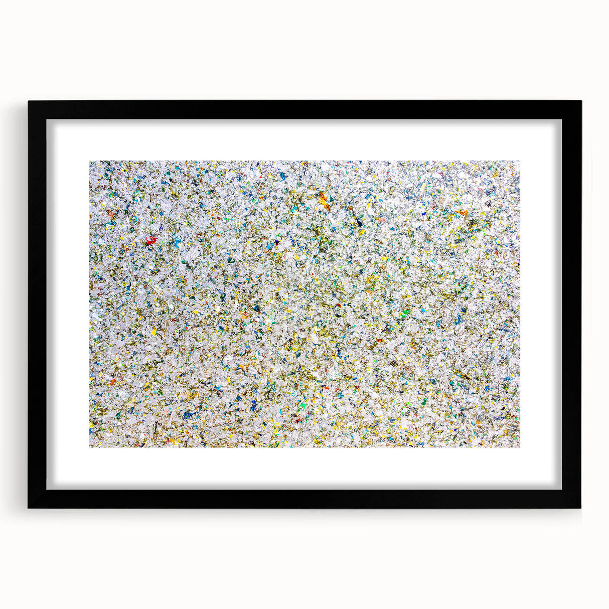 Abstract splatter art frame in black, showcasing vibrant colors against a mat background, perfect for modern home decor and artistic displays.