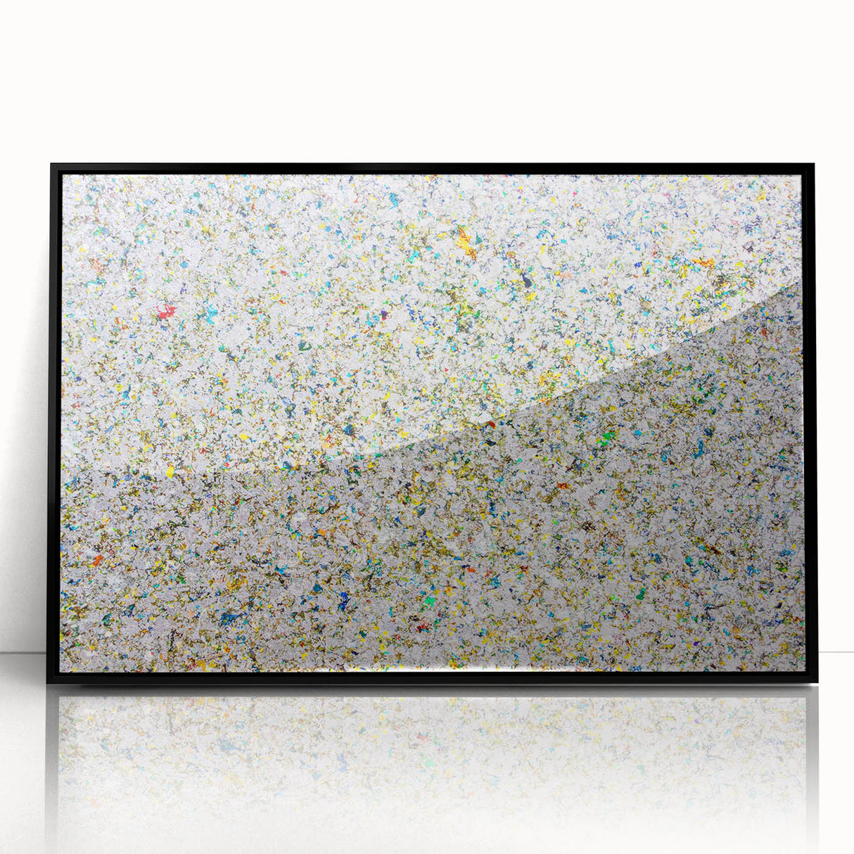 Framed acrylic artwork showcasing vibrant abstract splatters in black and multicolored hues, ideal for modern home decor, enhancing contemporary aesthetics.