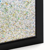 Colorful abstract splatter art print on canvas, showcasing vibrant hues of blue, yellow, and red, framed elegantly for modern home decor. Perfect for contemporary art enthusiasts.