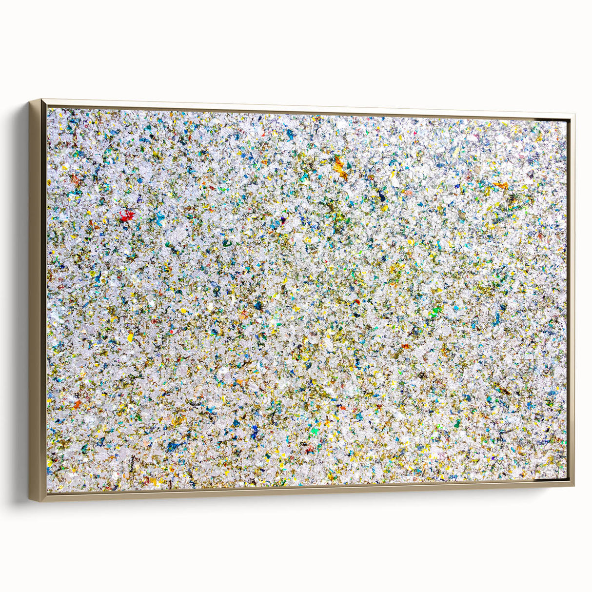 Framed canvas artwork showcasing abstract gold splatters on a textured background, presented in a stylish side view, perfect for modern home decor.