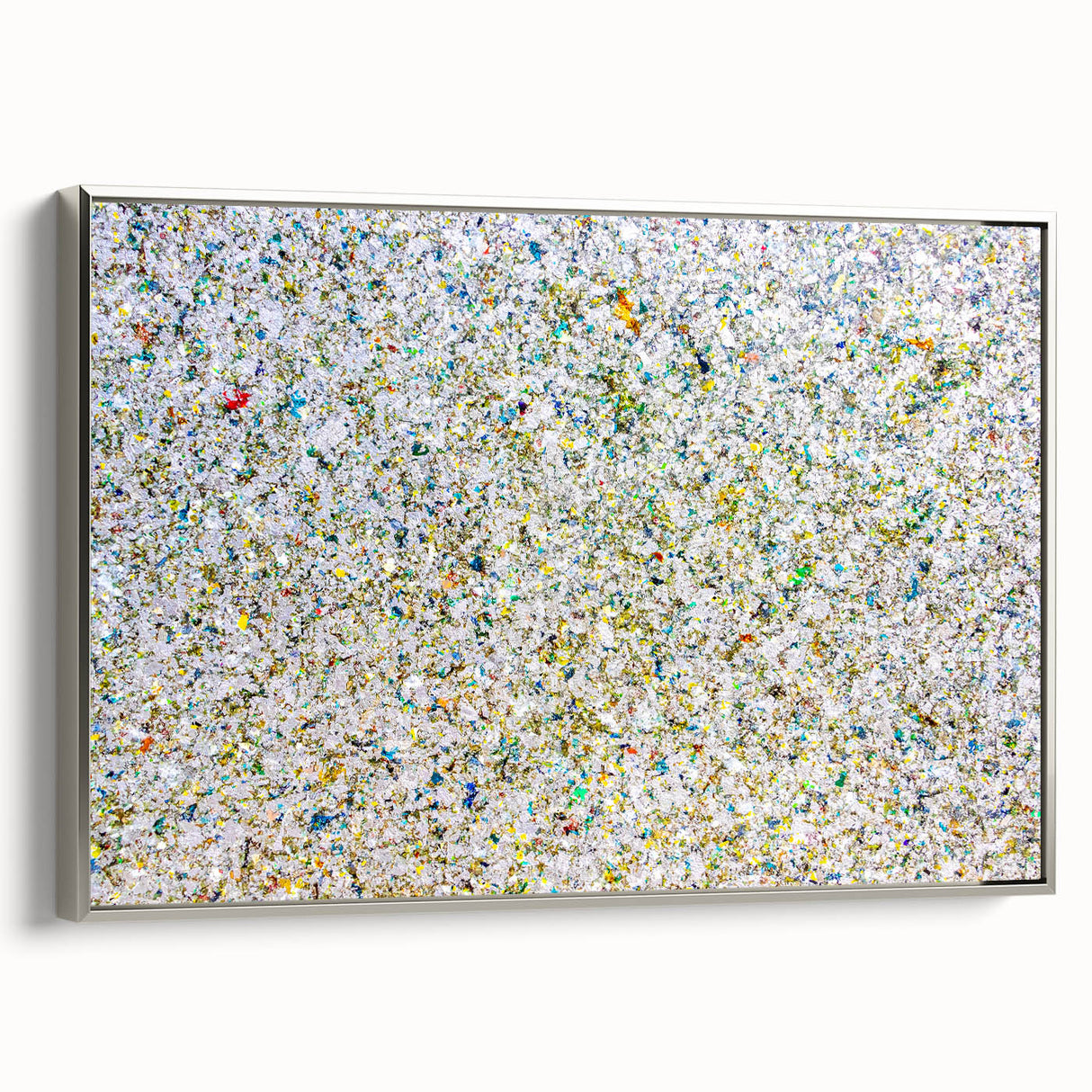 Framed canvas artwork showcasing abstract splatter designs in vibrant colors, with a sleek silver frame, ideal for modern home decor and artistic interiors. This piece adds a contemporary touch to any living space, enhancing aesthetic appeal.