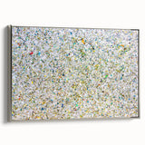 Framed canvas artwork showcasing abstract splatter designs in vibrant colors, with a sleek silver frame, ideal for modern home decor and artistic interiors. This piece adds a contemporary touch to any living space, enhancing aesthetic appeal.