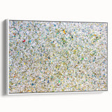 Framed abstract art canvas showcasing colorful splatters against a white background, presented in a stylish side view, perfect for modern home decor.
