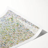 Abstract splatter art print on textured paper showcasing vibrant colors of blue, yellow, and pink, rolled securely in a protective cardboard tube for easy display.