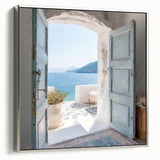Framed canvas featuring a vintage poster of a Greek door architecture in black with colorful art accents.