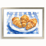Abstract art print of assorted pastries in muted earth tones, framed in silver, ideal for kitchen wall art.