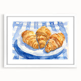 Abstract art print of assorted pastries in soft beige and cream tones, framed in white, suitable for dining room decor.