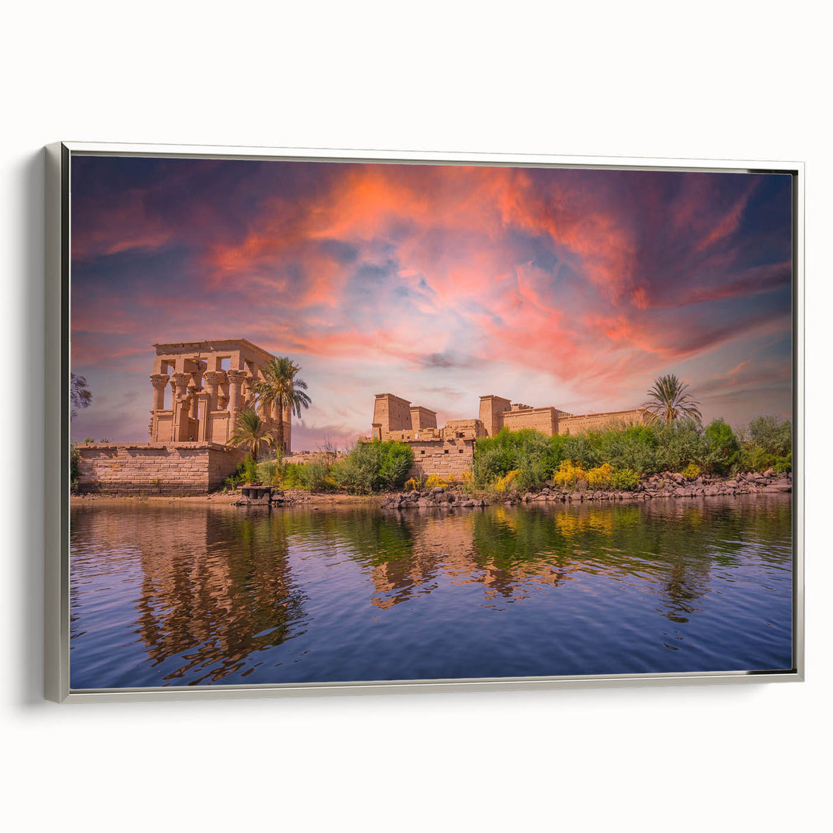 Vintage poster art of an Egyptian landscape on a silver-framed canvas, featuring vibrant colors, ideal for living room decor.