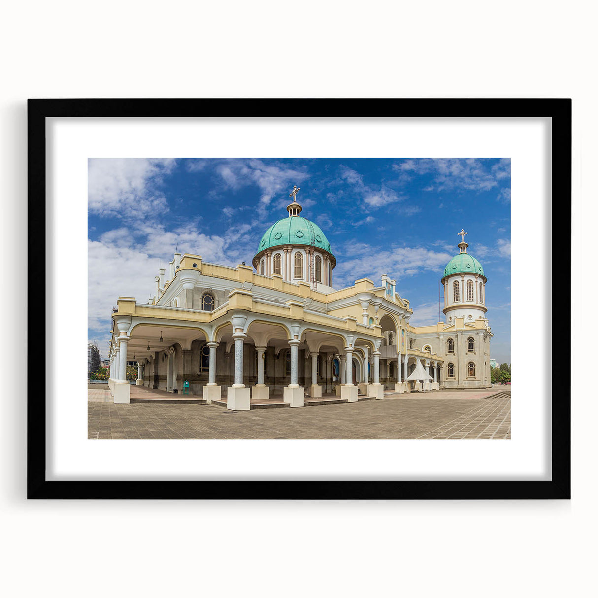 Colorful abstract art print featuring a textured landscape of Ethiopia, in a large black frame with mat.