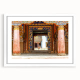 Abstract art print of Bhutanese scenery in muted earth tones on a framed white mat, ideal for dining room decor.