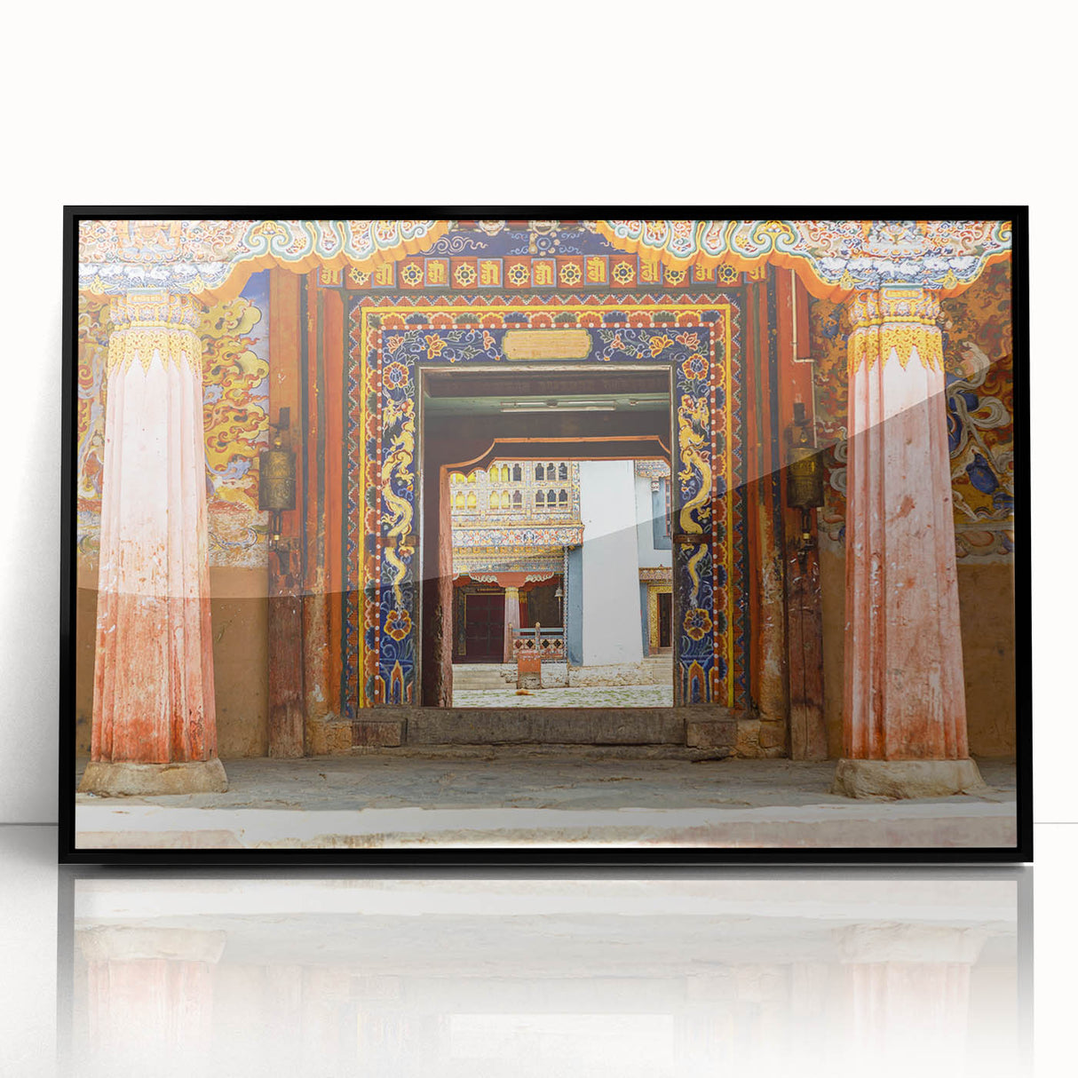 Large abstract wall art depicting a serene Bhutanese landscape in muted earth tones, framed in black acrylic.