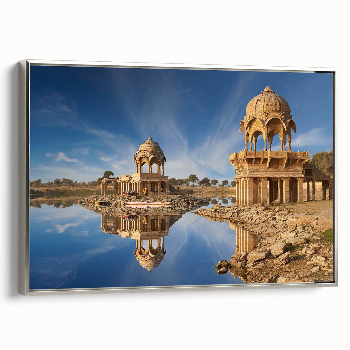 Landscape art painting of an Indian scenery on framed canvas, with vibrant colors against a black background.