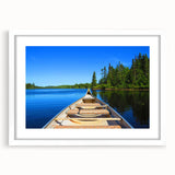 Abstract art print of Quebec scenery in muted blue and green tones, framed with a white mat, ideal for dining room decor.