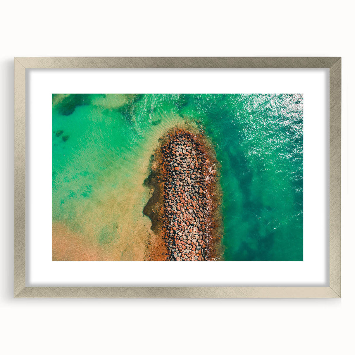 Extra large abstract art print featuring textured Caribbean scenery in muted blue and green tones, framed in silver.