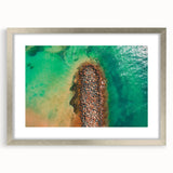 Extra large abstract art print featuring textured Caribbean scenery in muted blue and green tones, framed in silver.