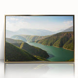 Large acrylic print of a serene Albanian landscape in muted greens and blues, framed in gold.