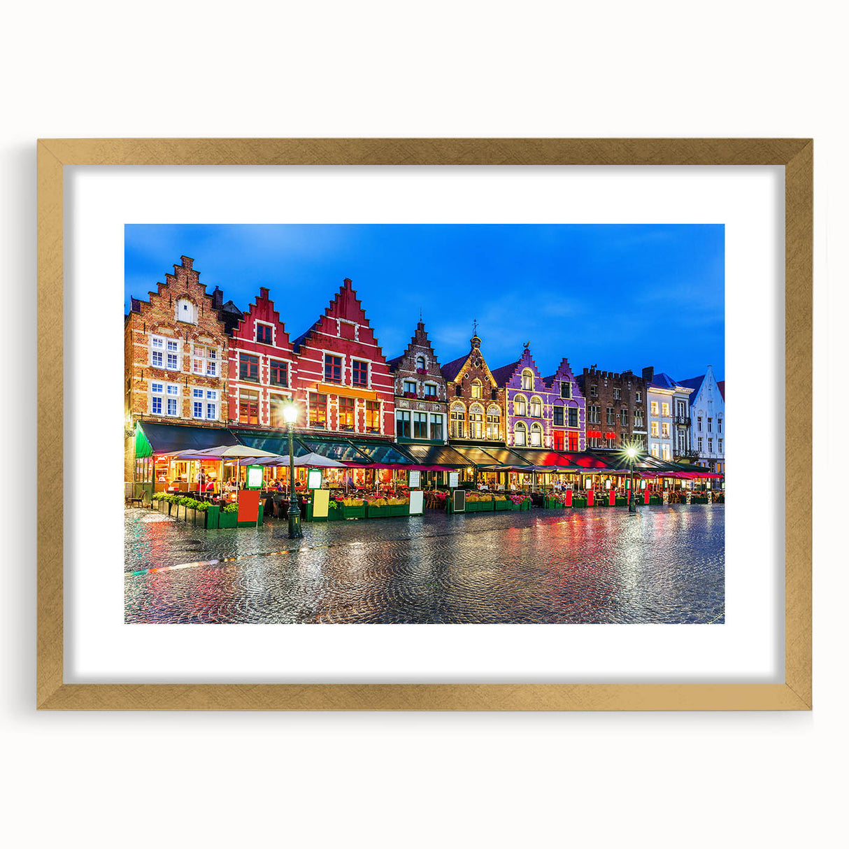 Abstract art print of European scenery in muted gold and blue tones, framed with a golden mat.