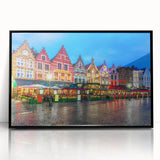 Large abstract wall art depicting a European cityscape in muted gray and blue tones, framed in black acrylic.