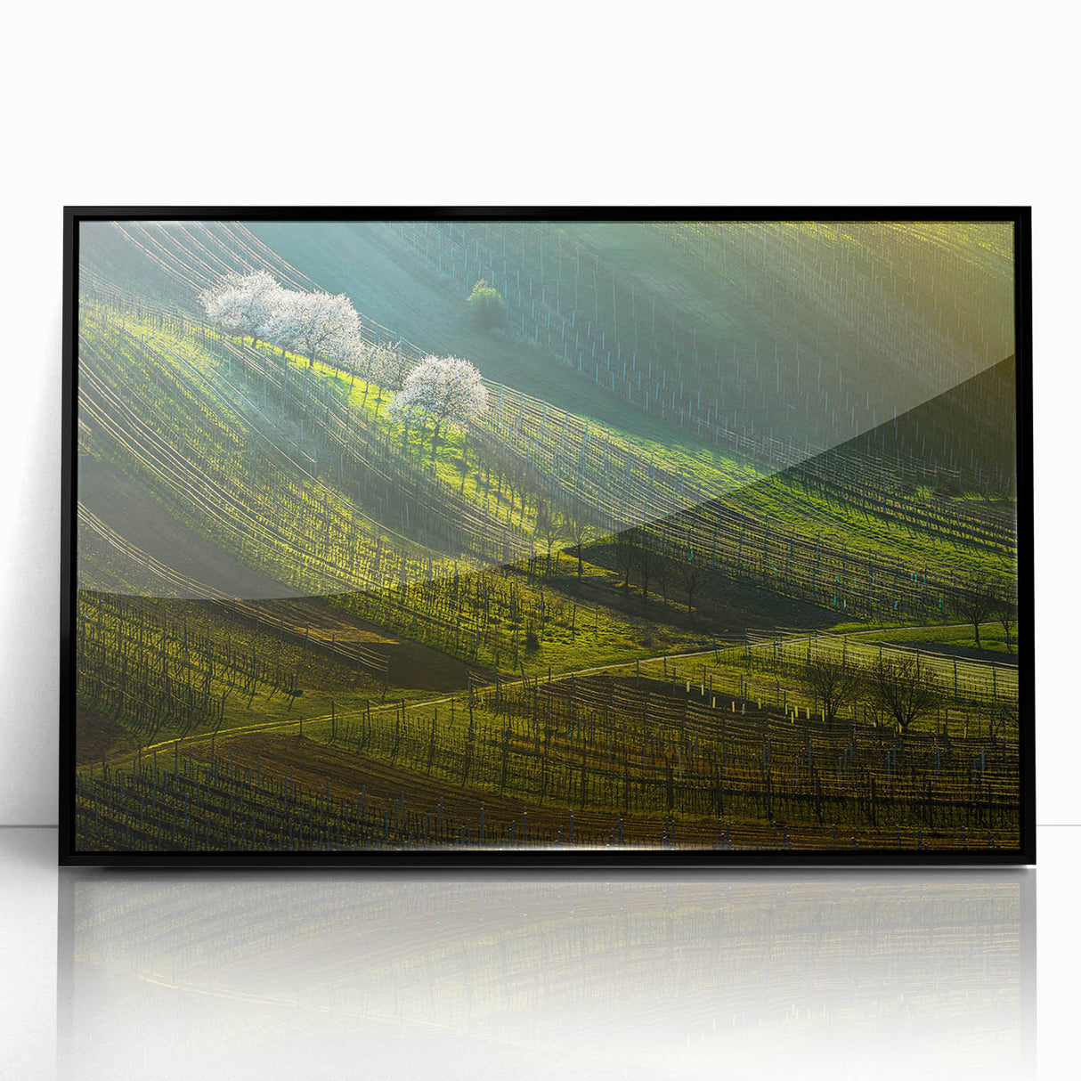 Large abstract wall art depicting a European cityscape in muted grays and blues, framed in black acrylic.