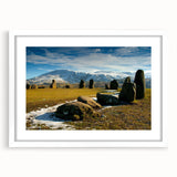 Textured abstract art print depicting a muted gray and blue English countryside, framed in white.