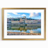 Abstract art print of Lyon, France in muted gold and blue tones on a framed canvas, suitable for dining room decor.