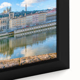 Extra large framed canvas of a textured Lyon cityscape in black with colorful accents, ideal for living room decor.
