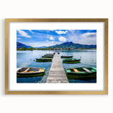 Abstract art print of a Bavarian landscape in muted blues and greens on a gold-framed canvas, suitable for dining room decor.