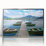 Large art print of a Bavarian landscape in muted green and blue tones on a silver-framed acrylic.