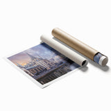 A rolled canvas print featuring a European scenery with soft floral accents in muted green and pink tones.