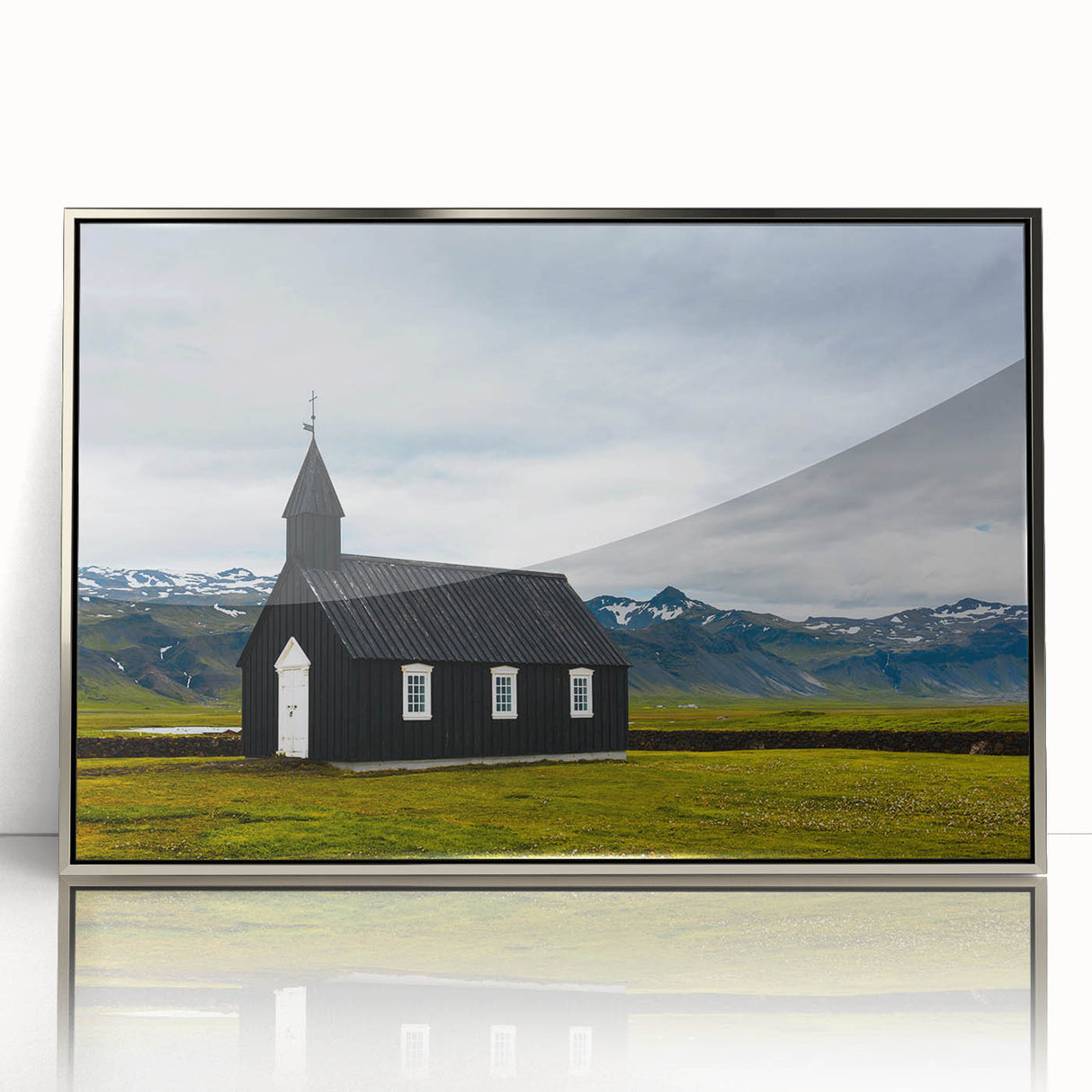 Large art print of a serene Icelandic landscape in muted blue and green tones, framed in silver acrylic.