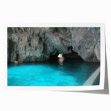 Rolled print of Capri, Italy, featuring vibrant blue sea and floral foreground, ideal for art wall dining room.
