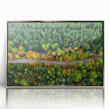 Large acrylic print of a European landscape in Latvia, framed in silver, displaying muted earth tones.