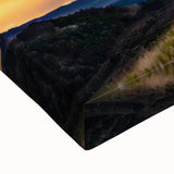 Large art depicting a black and white landscape of a European countryside on stretched canvas, ideal for bedroom decor.