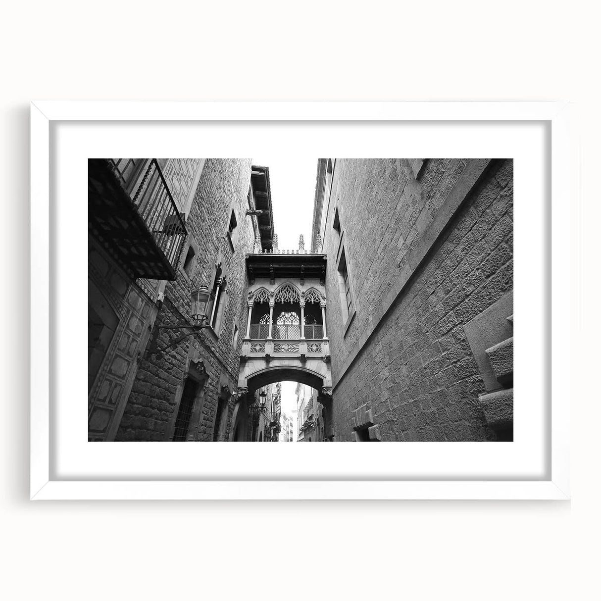 Textured abstract art print depicting a muted color palette of Barcelona scenery, framed in white.