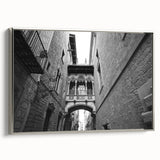 Framed canvas of a vintage Barcelona landscape painting in silver, featuring colorful art on a black background.