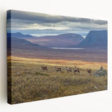 Side view of a stretched canvas featuring a serene Swedish landscape in muted green and blue tones.