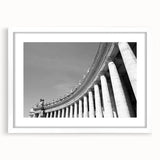 Abstract art print of the Vatican scenery in muted earth tones on a framed white mat, suitable for dining room decor.