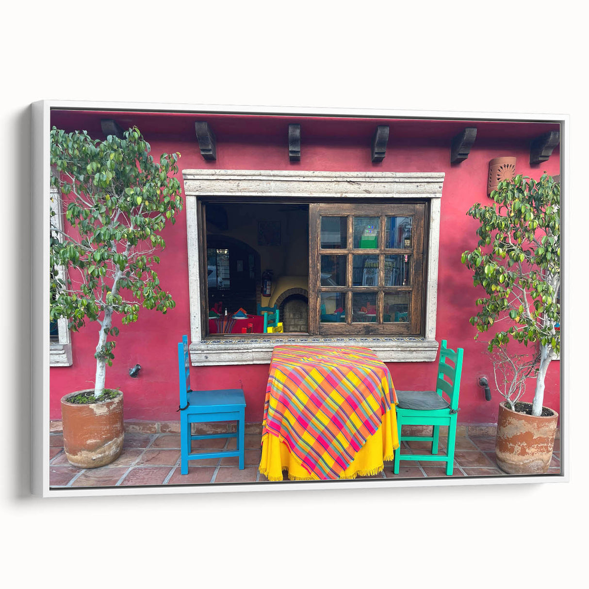 Vintage poster art of Cabo San Lucas with colorful imagery on a white-framed canvas, ideal for living room decor.