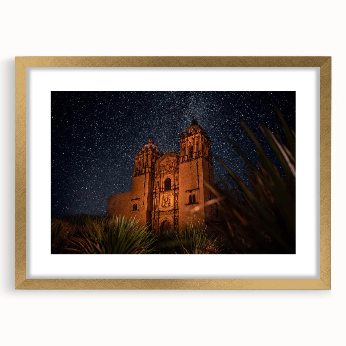 Extra large abstract art print featuring textured scenery of Oaxaca in muted earth tones, framed in gold.