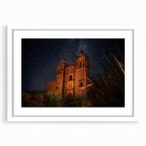 Abstract art print depicting Oaxaca scenery in vibrant blue and green tones on a white framed canvas.