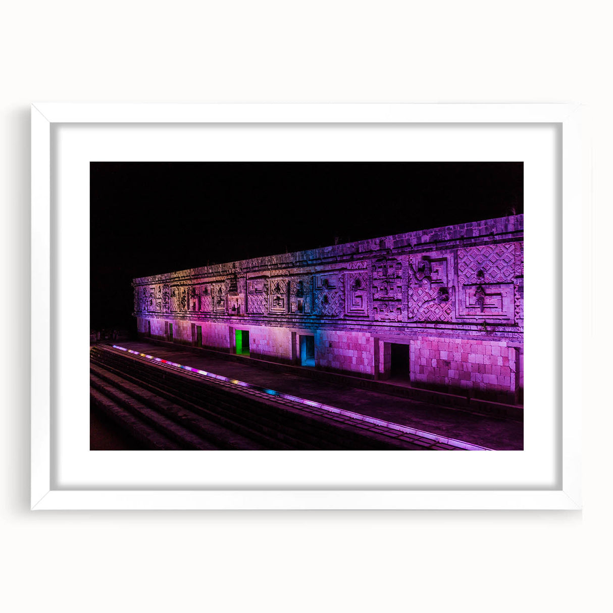 Abstract art print of Yucatan scenery in muted green and blue tones on a framed white mat.
