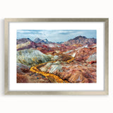 Textured art print of an abstract Middle Eastern scenery in muted earth tones on a framed silver mat.