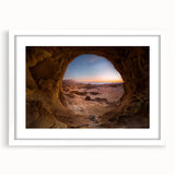 Abstract art print depicting a middle-eastern scenery in muted earth tones, framed with a white mat.