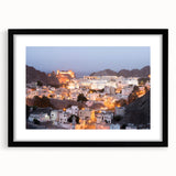 Abstract art print of Middle Eastern scenery in vibrant colors on a large textured canvas, framed in black.