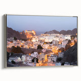 Framed canvas featuring a vintage-style landscape painting of Oman with vibrant hues and black accents.