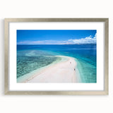 Textured abstract art print depicting an oceanic scene in cool blue and silver tones, framed in silver.