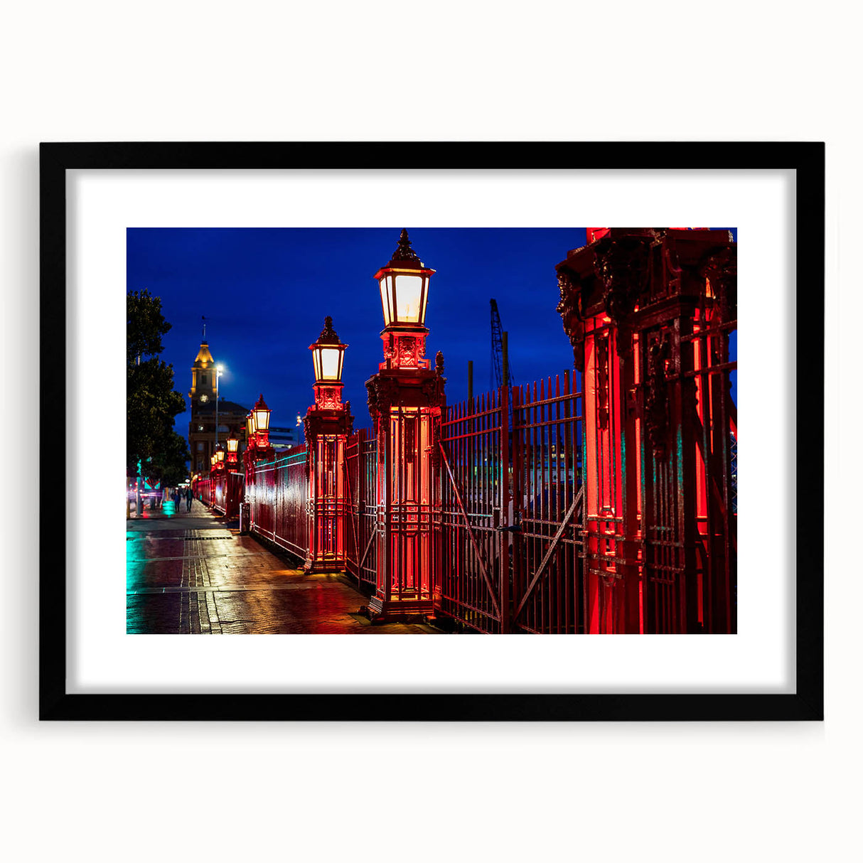 Extra large abstract art print of Auckland skyline in vibrant, colorful hues on a textured canvas, framed in black.