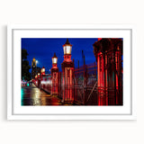 Abstract art print of Auckland skyline in muted blue and gray tones on a framed white canvas, suitable for dining room decor.