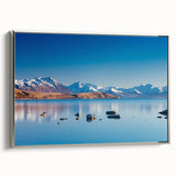 Framed canvas of a colorful New Zealand landscape, featuring muted greens and blues, ideal for living room decor.